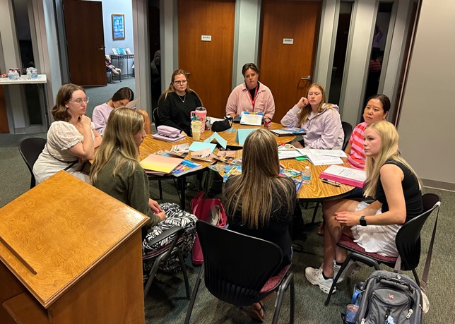 Math Clinic teachers discuss how to make math relevant for the K-12 students they will teach this fall.  Students Pictured: Harper Will, Sierra Craig, Regan Shugart, Haili Johnson, Nattie Rogers, Chloe Goins, Jessica King, Zoe Hale, Chloe Blan