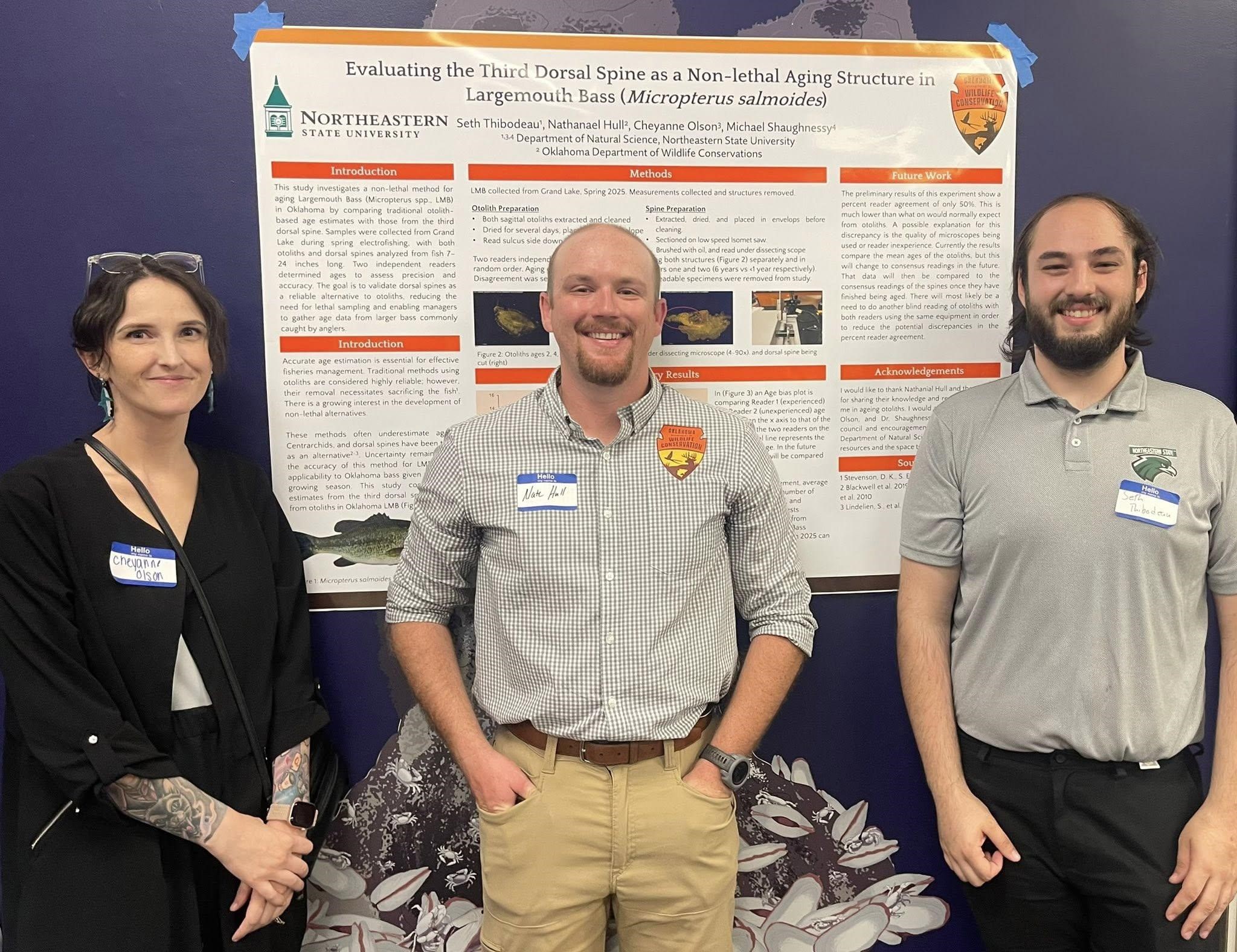 Dr. Cheyanne Olson, Nathanael Hull, and Seth Thibodeau with their poster.