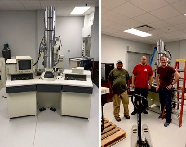 Hitachi H-7000 Transmission Electron Microscope (TEM). Dr. Nathan Green beside two people from BA facilities in front of the Electron Microscope. 