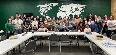 Current ASL students, ASL program alumni, and members of the Deaf Community pose for a photo during a recent ASL Game Night.