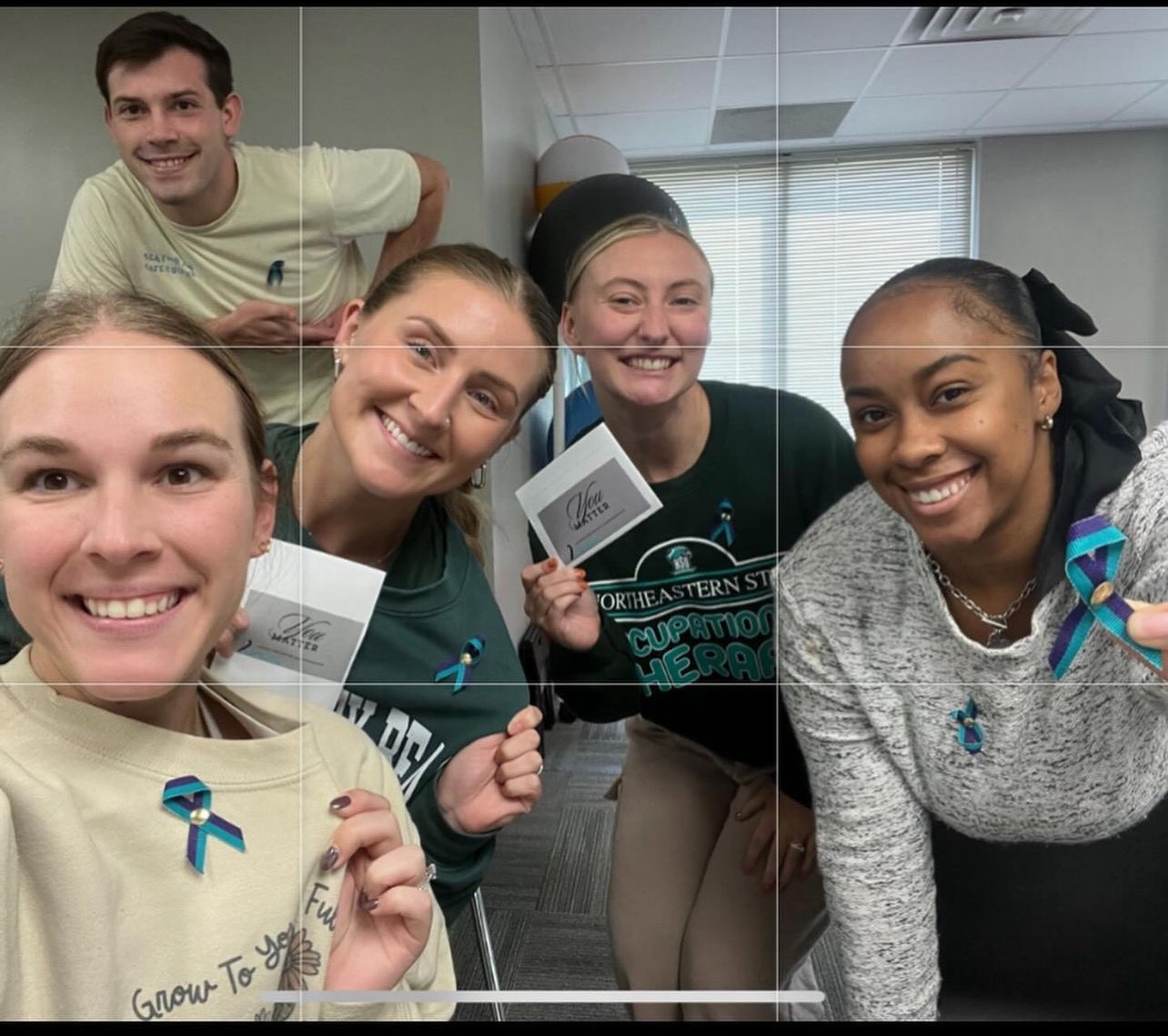 NSU Occupational Therapy students supporting Suicide Prevention Awareness month by wearing teal and purple ribbons.