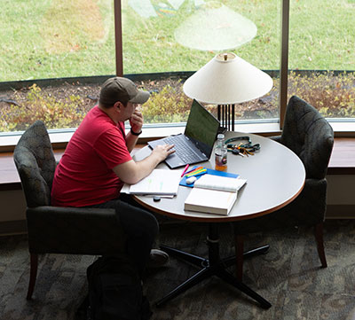 student studying on the BA campus